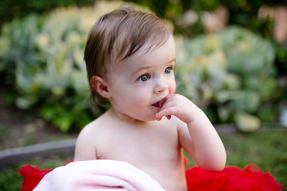 adorable one year old baby girl eating her fingers - bay area natural light outdoor portraits