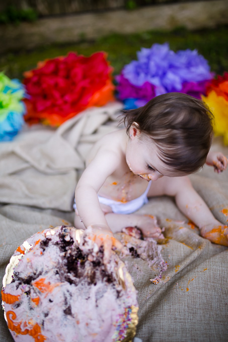 baby flipping her first birthday cake