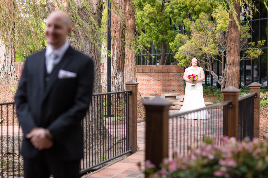 first look - bride approaching groom from the back