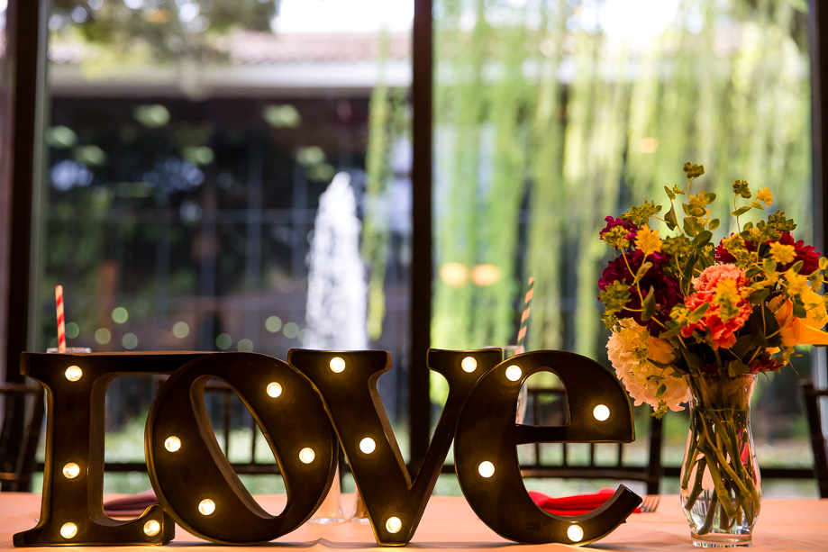 huge love sign at head table - reception hall decoration