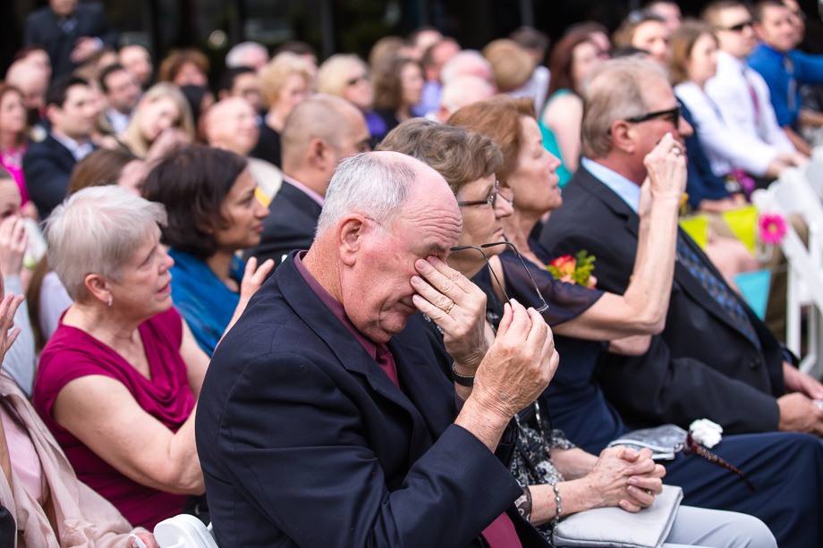 wedding guests wiping away their happy tears