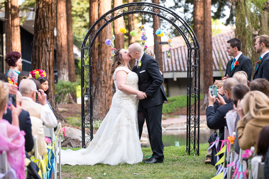 newlyweds sharing their first kiss