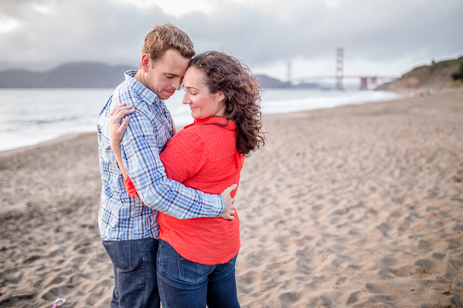 romantic sunset engagement photo in front of the Golden Gate Bridge