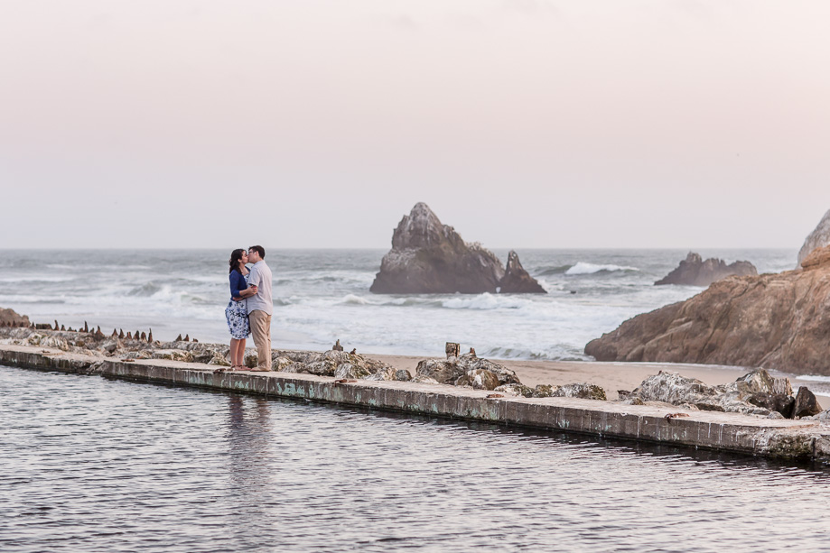 a romantic kissing shot at Sutro Baths - San Francisco engagement photo