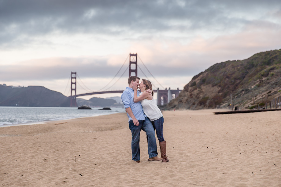 beautiful romantic golden gate bridge engagement photo on baker beach