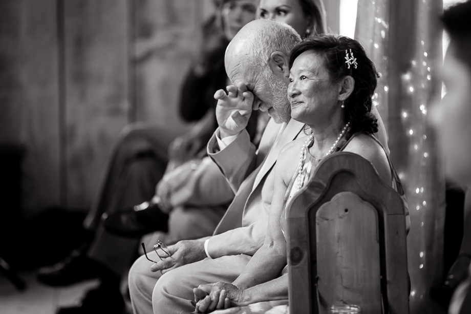 priceless and powerful emotion - grooms parents during the wedding ceremony