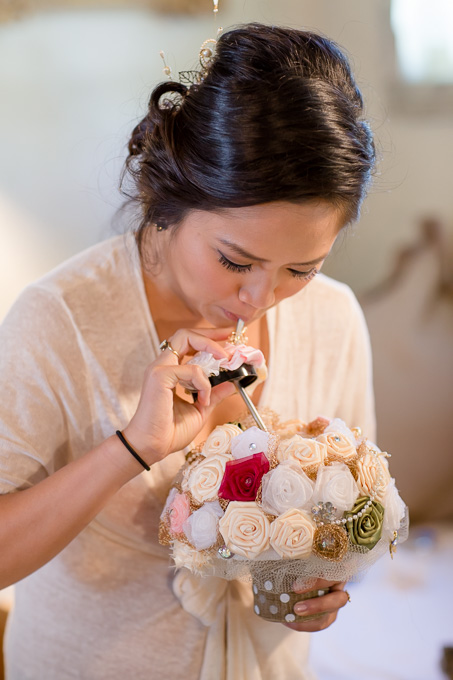 bride sipping beer from a silk bridal bouquet