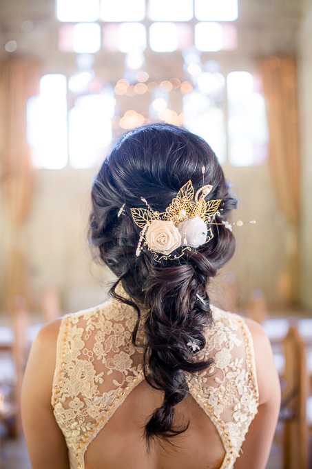 an elegant bridal down do with braids - gold hairpiece
