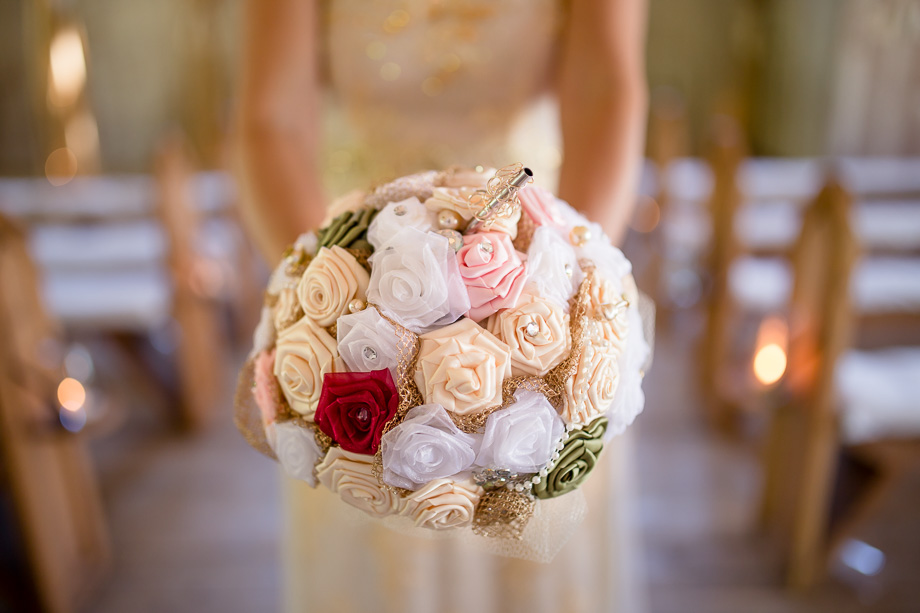 A DIY handmade silk bridal bouquet with hidden beer bottle inside, genius!