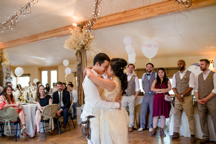 bride and groom enjoying their first dance