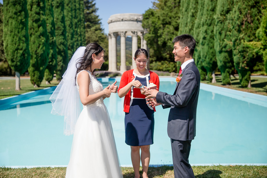 a happy ring exchange in front of the pulgas water temple