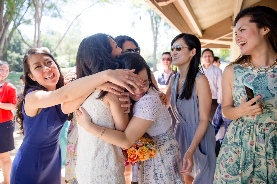 group hug with wedding guests
