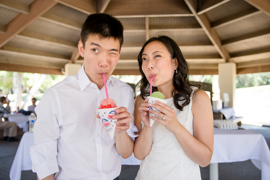 bride and groom enjoying their shaved ice after the train ride at Vasona park