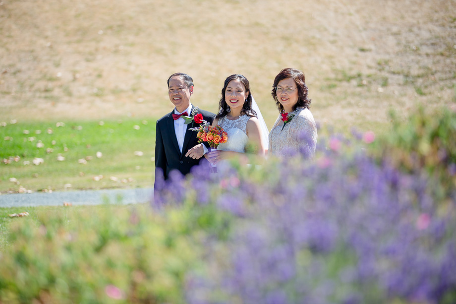 pulgas water temple- a peek of the bride and her parents right before they walk down the aisle for the ceremony