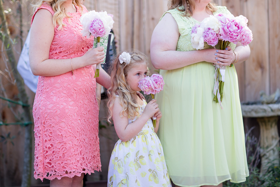 bridesmaids and flower girl at the backyard ceremony