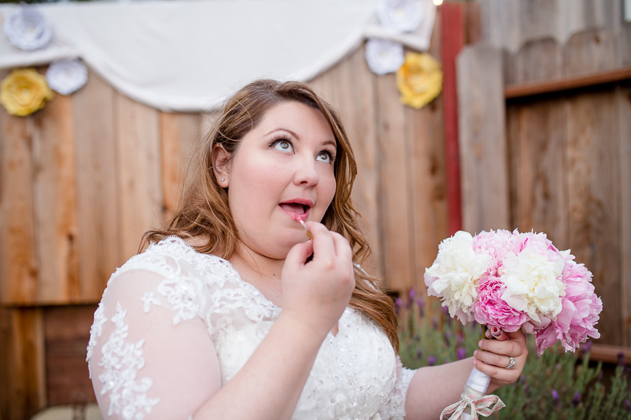 bride touching up her lips