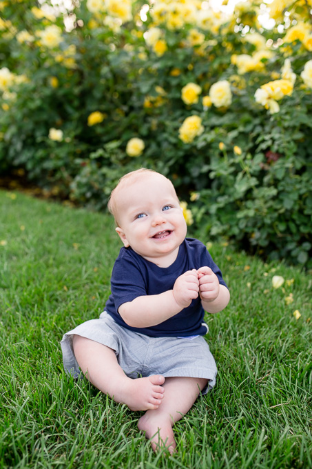 San Francisco baby photographer - adorable baby boy dancing on the grass