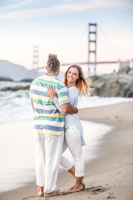 beatiful lifestyle engagement photo in front of Golden Gate Bridge