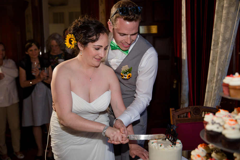newlyweds cutting their cake
