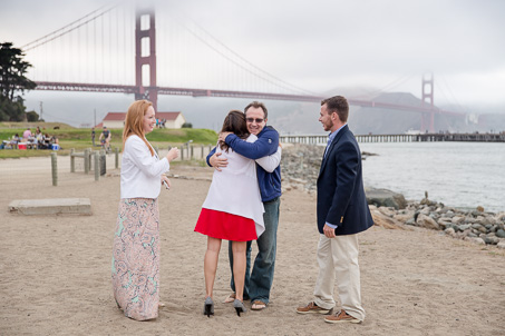happy hugs in front of the Golden Gate Bridge