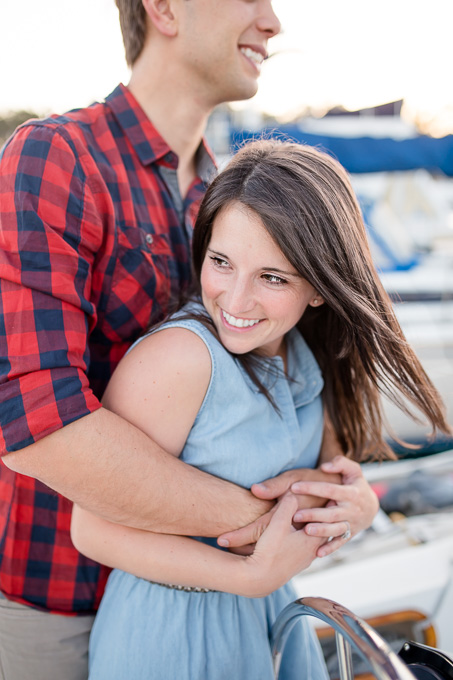 cute couple engagement portrait on a sailboat - Bay Area wedding photographer