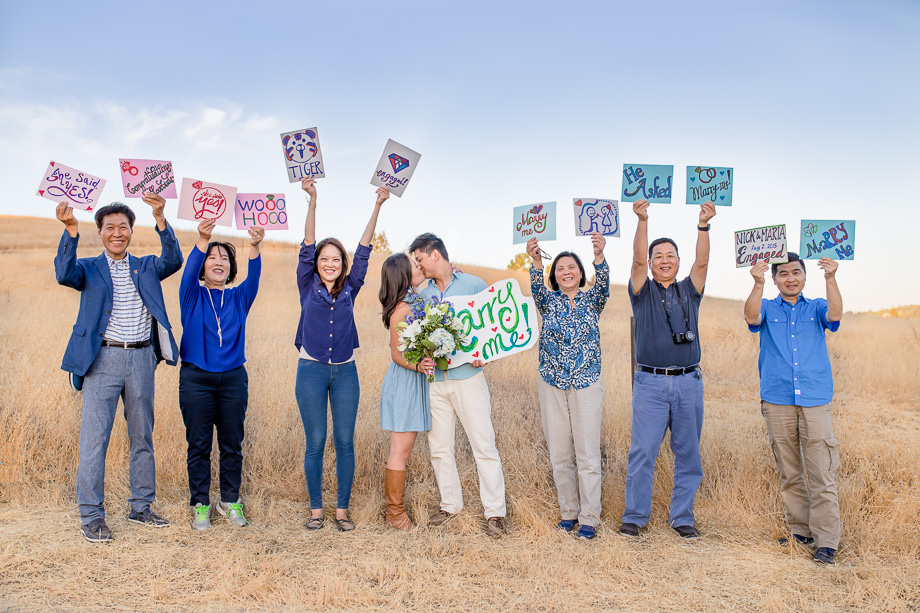 Arastradero Preserve - family celebrating the couples surprise proposal with cute DIY signs