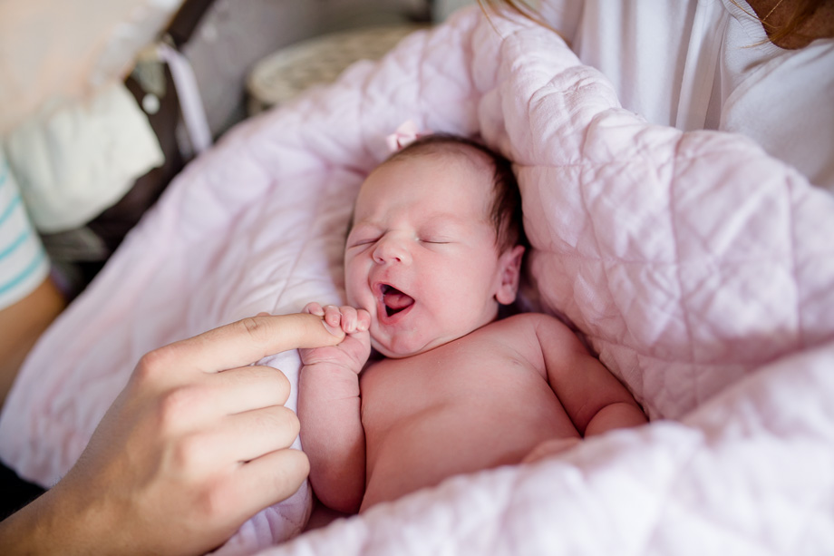 cute moment of the baby girl eating daddys finger - Los Gatos lifestyle newborn photographer