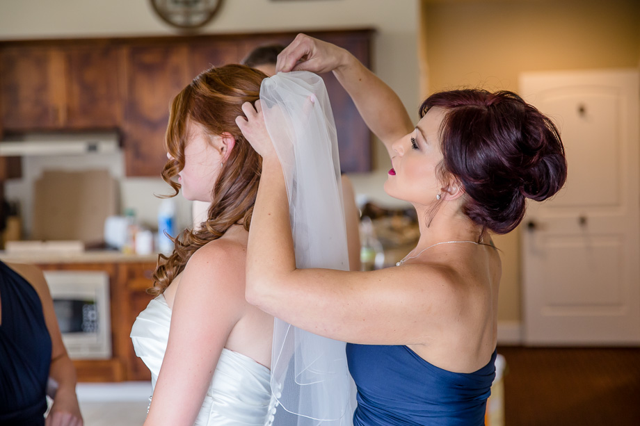putting the veil on the bride