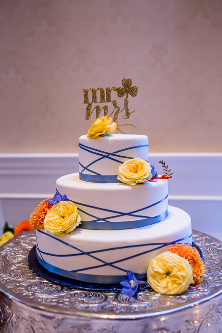 beautiful navy blue and yellow wedding cake