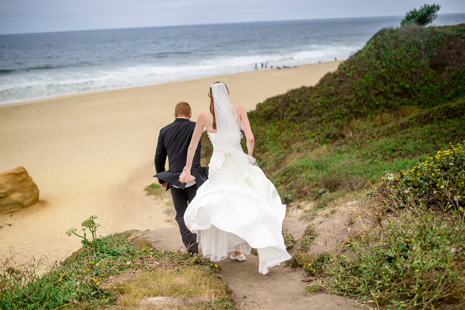 groom leading the way down to the Montara beach - beautifully captured candid moment
