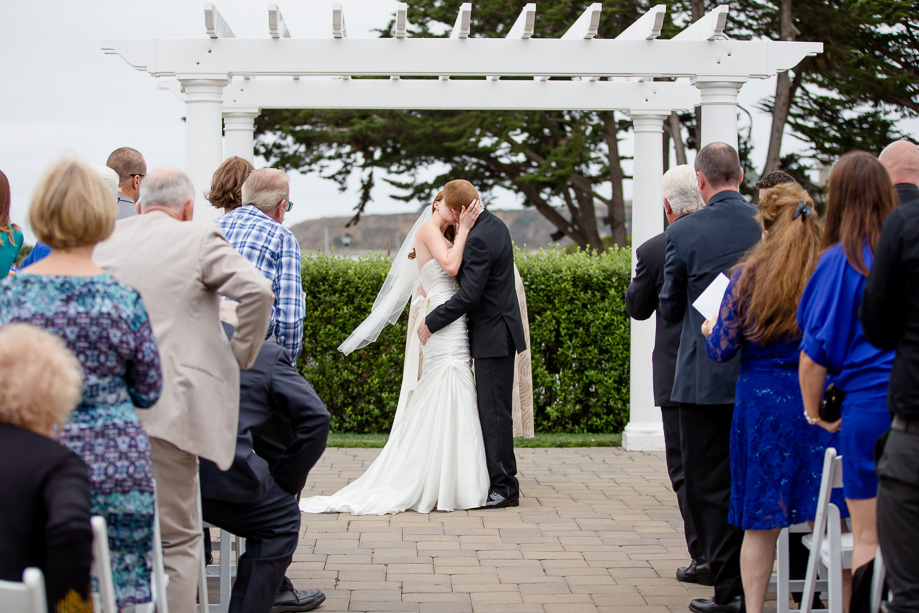 bride and grooms first kiss as husband and wife - Oceano Hotel and Spa real wedding