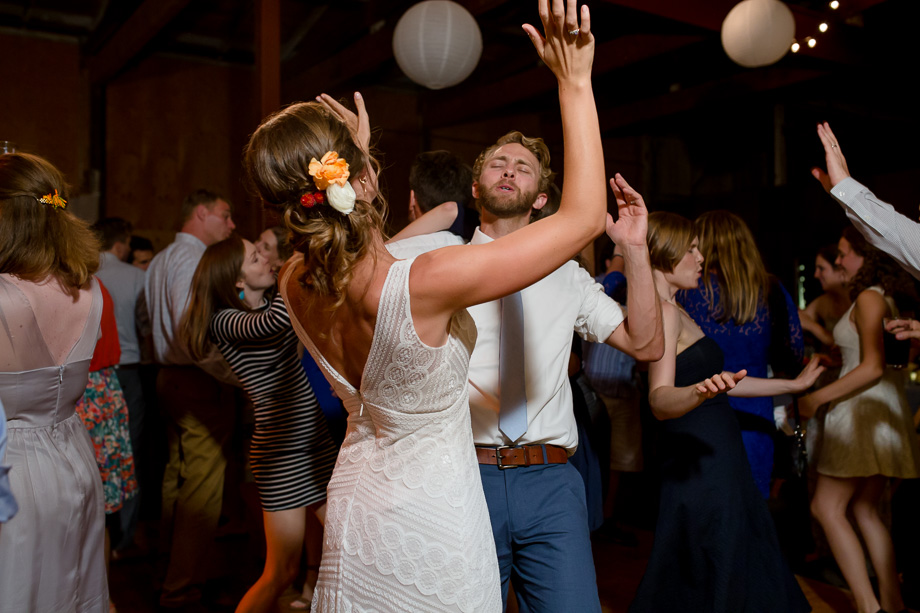 bride and groom having fun at the dance party - Tobys Feed Barn wedding reception