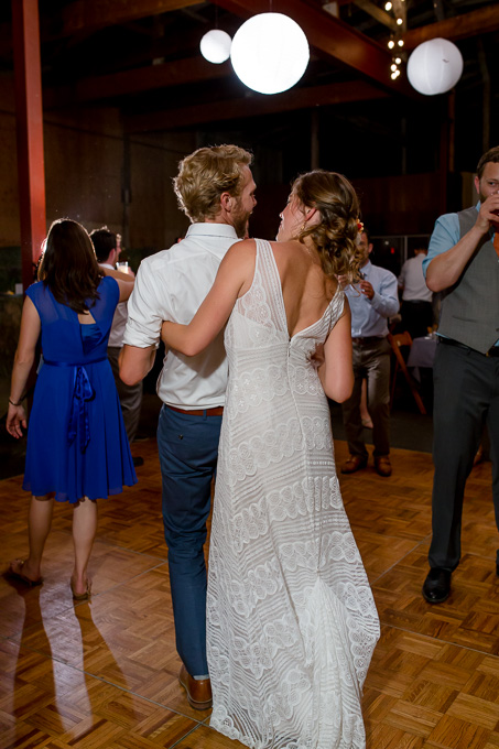 bride and groom having fun on the dance floor