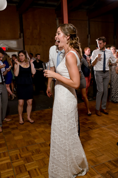 bride laughing during wedding reception