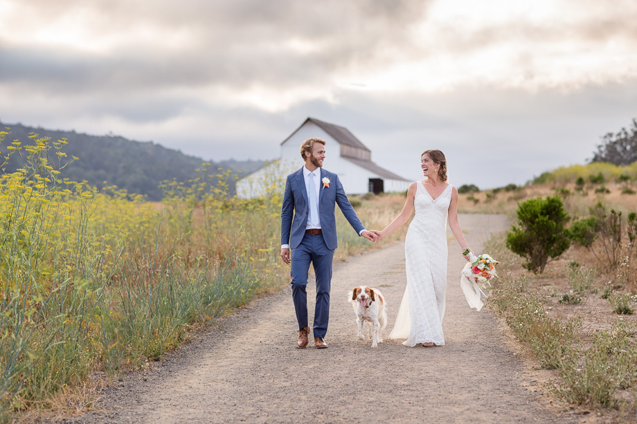 sweet wedding portrait on a quiet path of wild flowers at Giacomini Barn