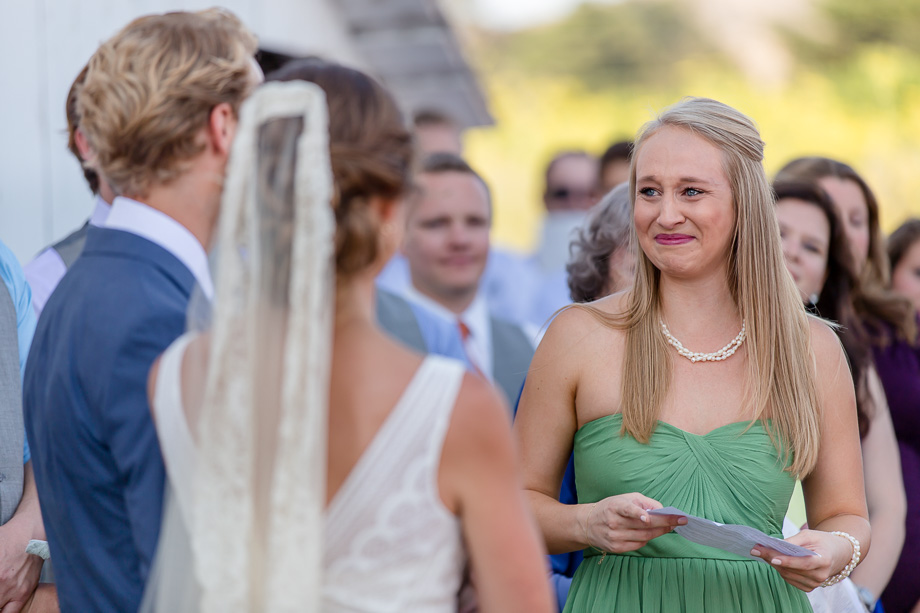 bridesmaid getting emotional when giving a speech during the wedding ceremony