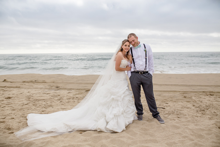 bride and groom portrait on a beach along highway one