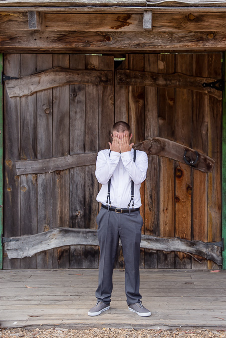 groom covering his face for the first look