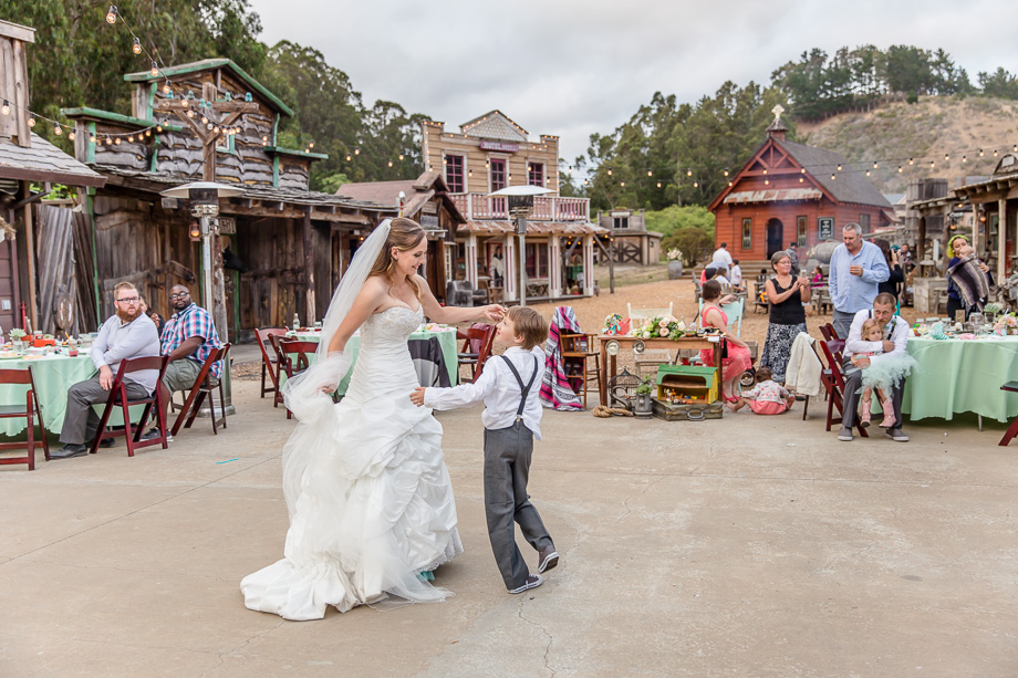 bride twerling with her son - half moon bay rustic wedding at long branch saloon and farms