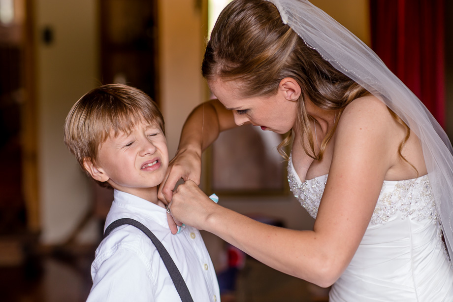 a funny photo of the bride and the ring bearer