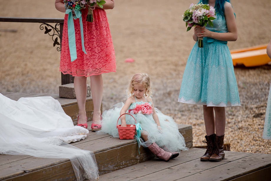 kids will be kids - adorable flower girl not paying attention at the ceremony