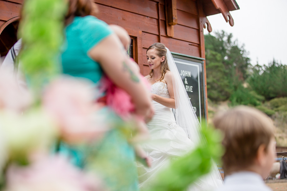beautiful bride reading her vows in front of the red rustic barn chapel - half moon bay wedding photographer