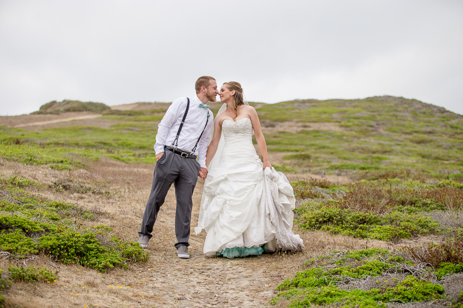 bride and groom portrait on a hill - half moon bay wedding
