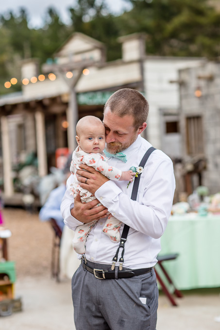 groom dancing with his little baby girl