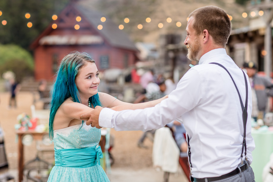 groom dancing with his teenage daughter