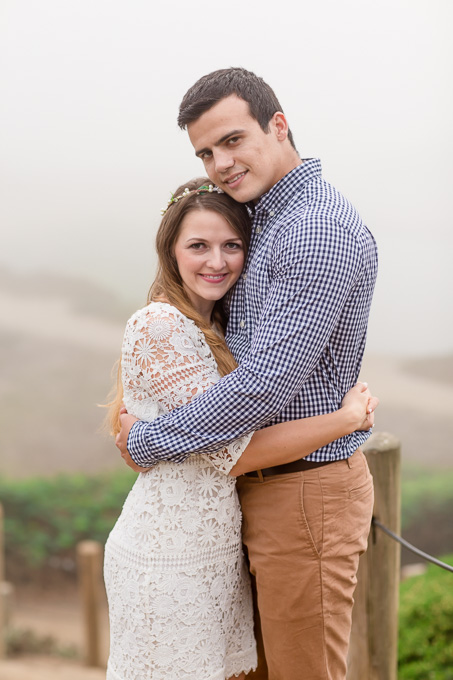 hugging engagement photo foggy background