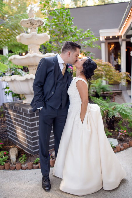 bride and groom kissing at Deer Park Villa wedding reception