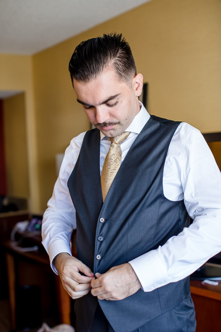 groom suiting up at the Courtyard Larkspur