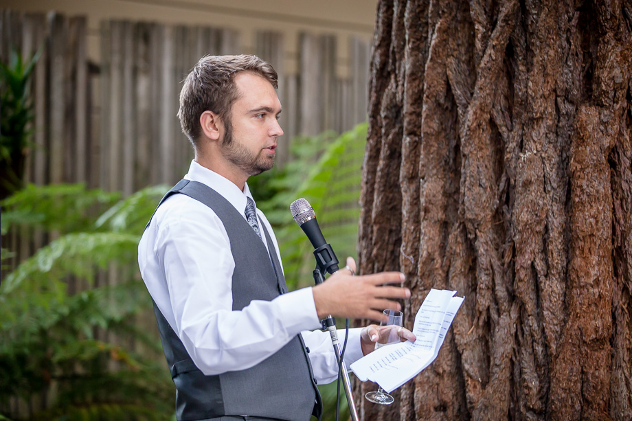 groomsman giving a toast by redwood tree