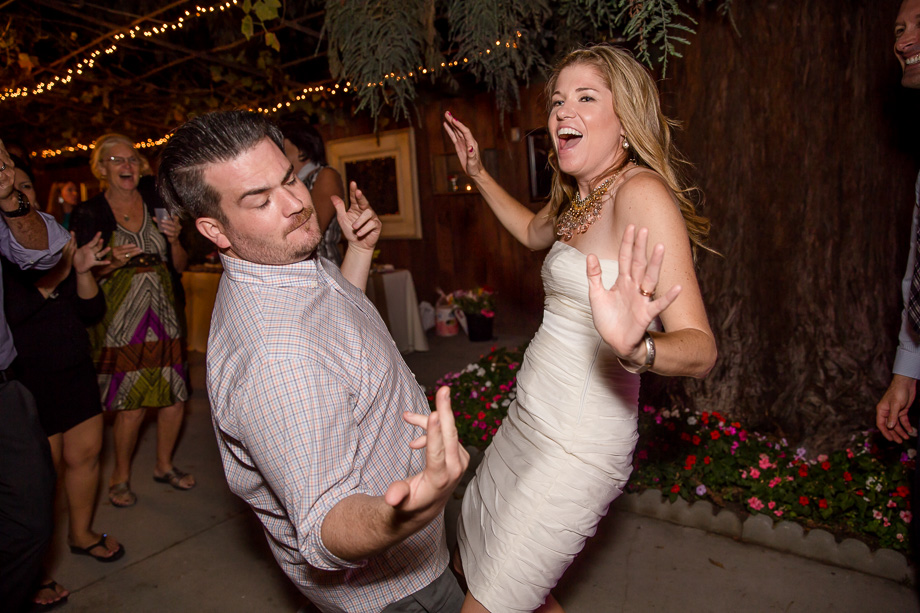 bride dancing with her brother on the dance floor